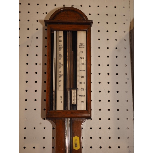 122 - A well reproduced mahogany cased stick barometer, by West Strand