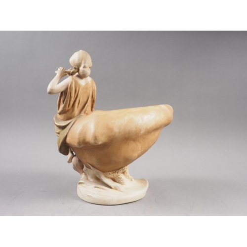 18 - A Royal Crown Dux table centre, formed as a girl playing a flute seated on a shell, 10 1/2