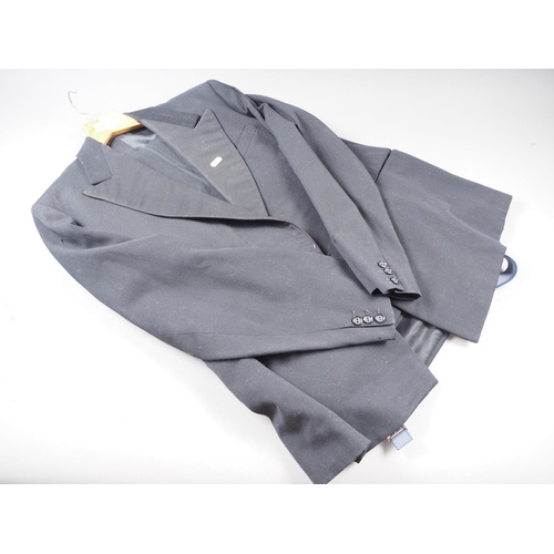 205 - A gentleman's dinner jacket and trousers, and two fur stoles