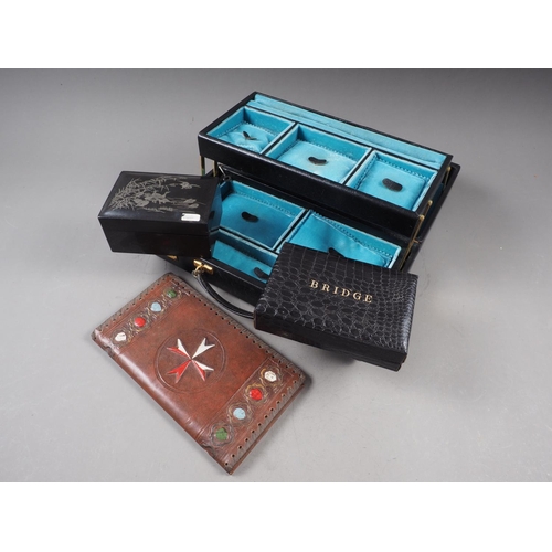 233 - A black leather hinged jewellery box, a bridge box, a Japanese lacquered box and a leather notepad