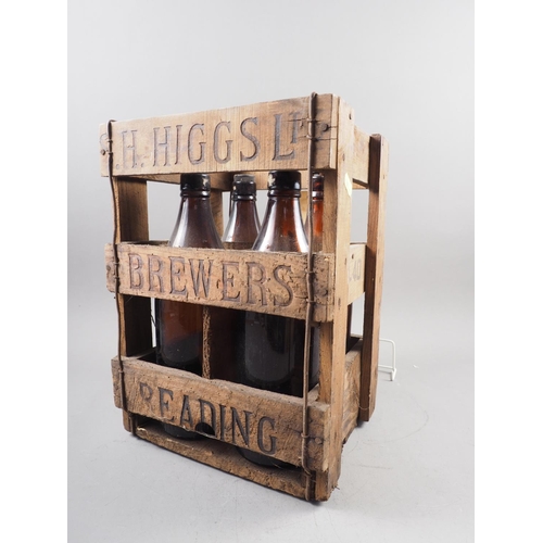 239 - An H Higgs Brewers of Reading four-division bottle crate with four matching bottles, tallest bottle ... 