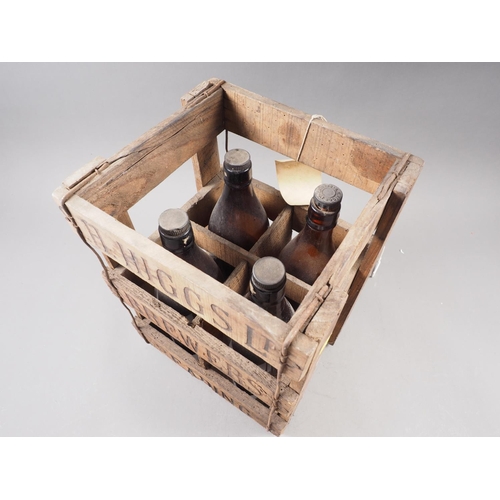 239 - An H Higgs Brewers of Reading four-division bottle crate with four matching bottles, tallest bottle ... 