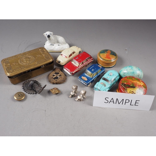 249 - A WW1 Christmas box, containing various cap badges, a Corgi Toys die-cast model Ford Consul Cortina,... 