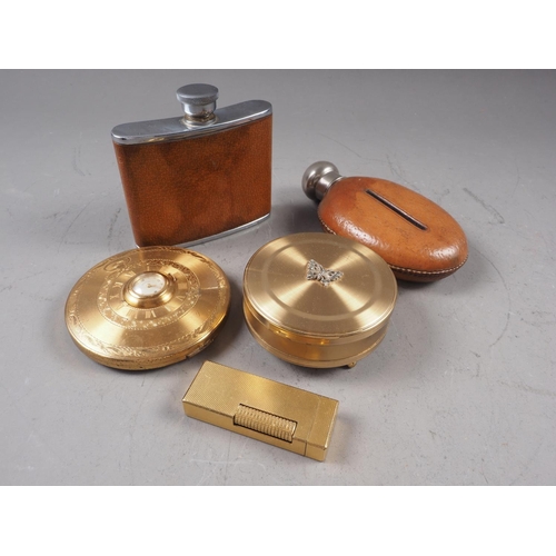 254 - Two gilt metal compacts, two hip flasks and a Dunhill cigarette lighter