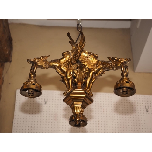 257 - A 19th century gilt bronze three-light ceiling pendant, mounted three griffons 17