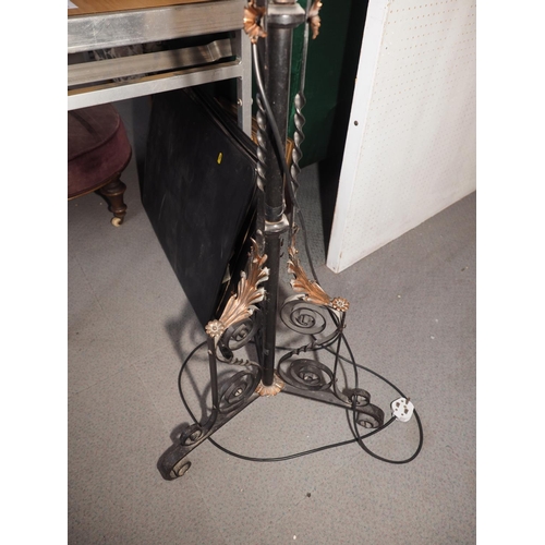 267 - An early 20th century wrought iron and copper adjustable oil lamp, on tripod scroll support (now con... 