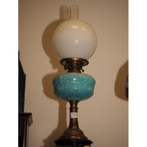 271 - A late 19th century brass oil lamp with milk blue glass reservoir decorated mask, flower and swags a... 