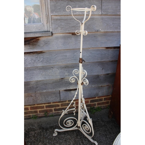 273 - A late 19th century white painted scrollwork standard lamp, on splay support, and a 