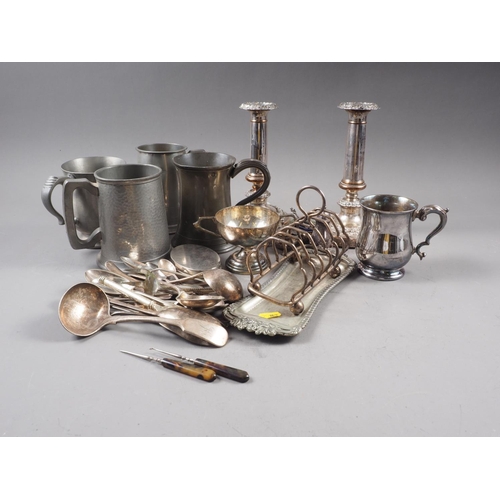 303 - A pair of Sheffield plated candlesticks, a silver plated tankard, a plated toast rack, plated flatwa... 