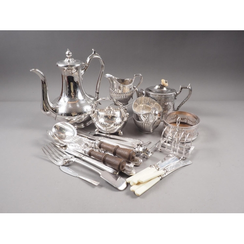 306 - A part canteen of silver plated cutlery, a plated coffee pot, a wine bottle coaster, loose fish kniv... 