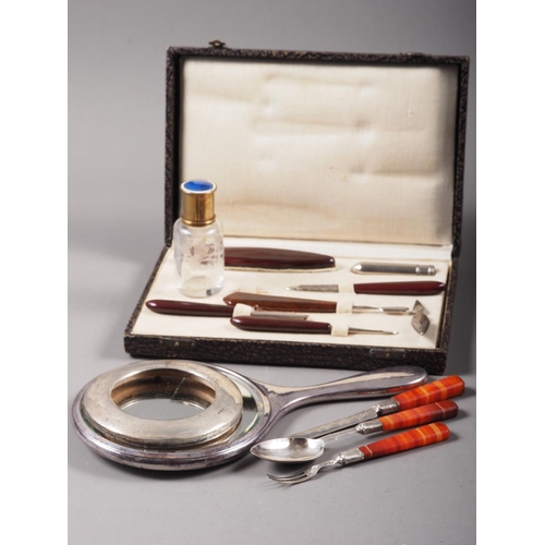 313 - A silver and banded agate handled three-piece christening set, in associated box, a Bakelite handled... 