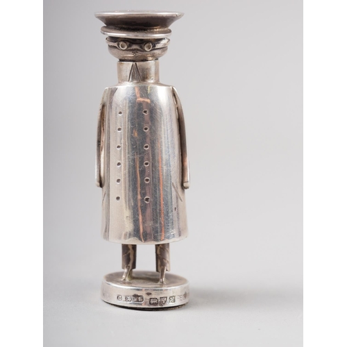 315 - An Edwardian novelty silver pepper shaker, formed as a stylised chauffeur, by Saunders & Shepher... 