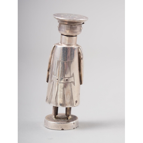 315 - An Edwardian novelty silver pepper shaker, formed as a stylised chauffeur, by Saunders & Shepher... 