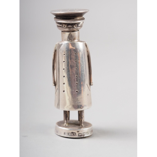 315 - An Edwardian novelty silver pepper shaker, formed as a stylised chauffeur, by Saunders & Shepher... 