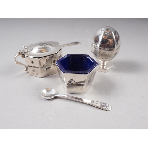 318 - A silver three-piece cruet set with niello  decoration, blue glass liners and spoons, 5.3oz troy app... 