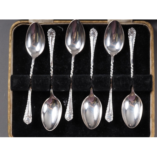 320 - A set of six silver teaspoons, in box, a similar set of five teaspoons, 3.4oz troy approx, and three... 