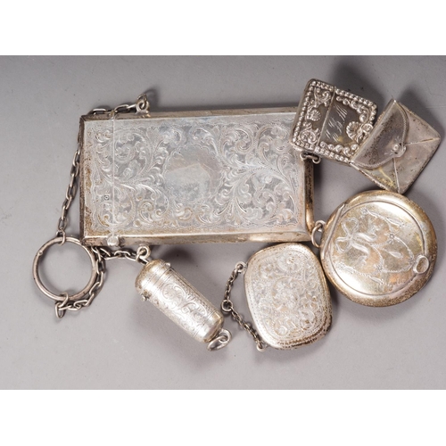 323 - A silver card case with engraved scrolled decoration, a silver cheroot holder, two stamp holders and... 