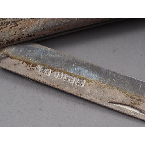 327 - A silver letter opener, formed as a Celtic style sword, 5 3/4