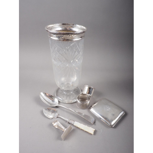 347 - A cut glass and silver topped celery vase, a cigarette case, a dessert spoon, two silver napkin ring... 