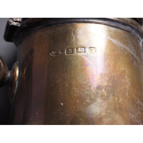 350 - A silver hot water jug of plain design with ebonised handle, on circular stepped base, 8