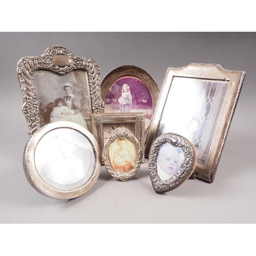 361 - Five silver photo frames of various sizes, a white metal mounted desk clock and another white metal ... 