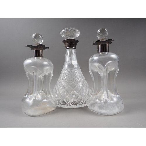 362 - A pair of silver collared glug glug decanters and stoppers, 8 3/4