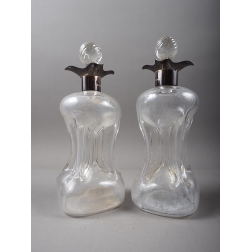 362 - A pair of silver collared glug glug decanters and stoppers, 8 3/4