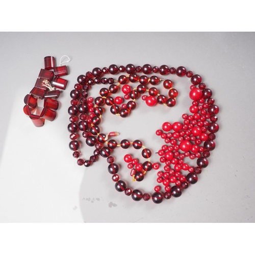 377 - A string of circular and faceted cherry amber Bakelite beads and a number of loose cherry amber Bake... 