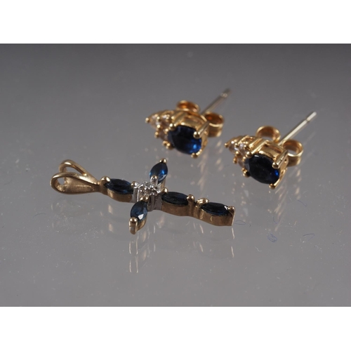 386 - A pair of yellow metal sapphire and diamond ear studs, and a matching cross