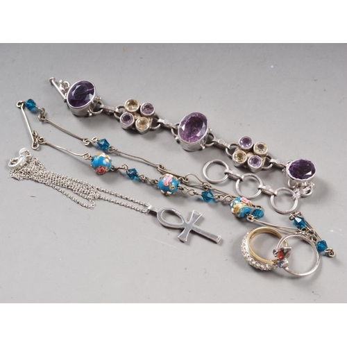 387 - A dress ring, an amethyst pendant, and other silver jewellery