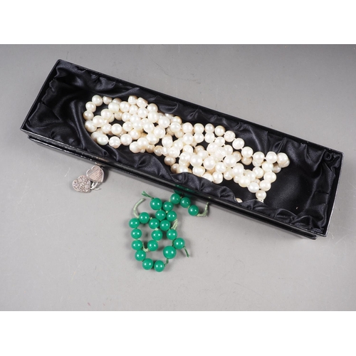 388 - A Victorian silver Mizpah brooch, a string of cultured pearls and a number of jadeite circular beads