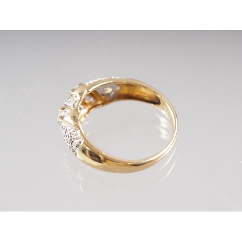 412 - An 18ct gold and diamond dress ring, size O, 4.4g