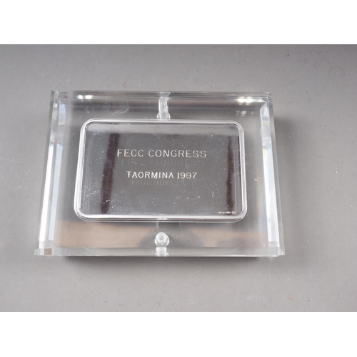 454 - A rectangular silver ingot, 100g, mounted in a perspex case