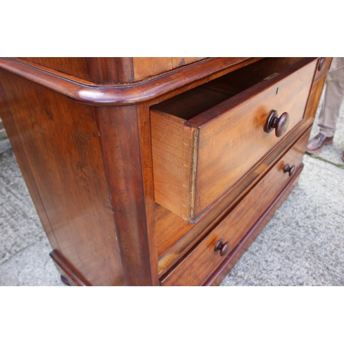 551 - A late Victorian figured mahogany linen press, the upper section fitted trays and shelves, enclosed ... 