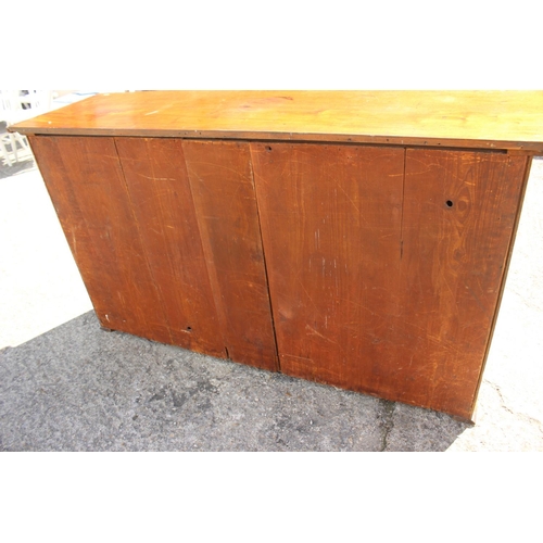 552 - A late 19th century mahogany linen cupboard, enclosed two panel doors, on block base, 66