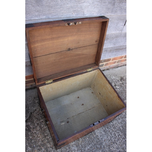 553 - A 19th century iron bound teak strong box/chest with brass carry handles, 26