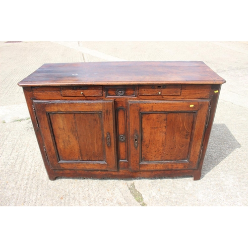 556 - A 19th century French carved fruitwood sideboard, fitted two drawers over cupboards, enclosed panel ... 