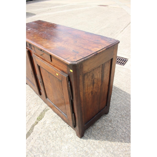 556 - A 19th century French carved fruitwood sideboard, fitted two drawers over cupboards, enclosed panel ... 