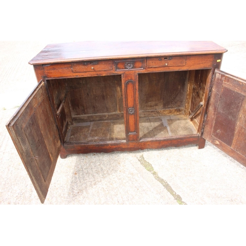 556 - A 19th century French carved fruitwood sideboard, fitted two drawers over cupboards, enclosed panel ... 