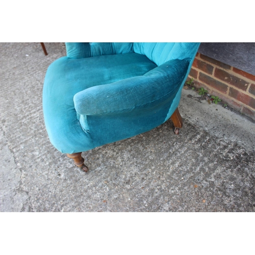 577 - A late 19th tub-shape occasional chair, button upholstered in a turquoise velour, on turned supports