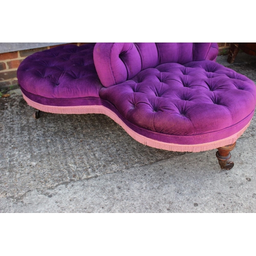 583 - A 19th century three-seat conversation settee, button upholstered in a purple Dralon, on turned and ... 