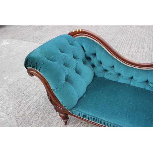 584 - A late 19th century mahogany framed chaise longue, upholstered in a turquoise velour, on turned and ... 