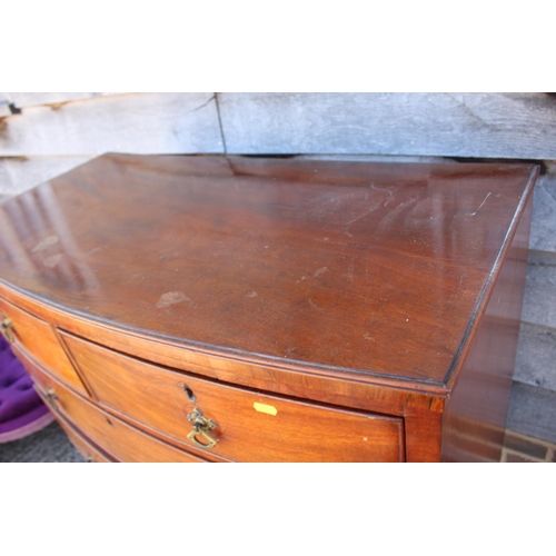 585 - A late 19th century mahogany bowfront chest of two short and three long graduated drawers with brass... 