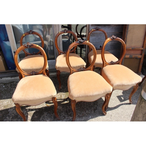 589 - A set of six 19th century carved walnut dining chairs with stuffed over seats, on cabriole supports