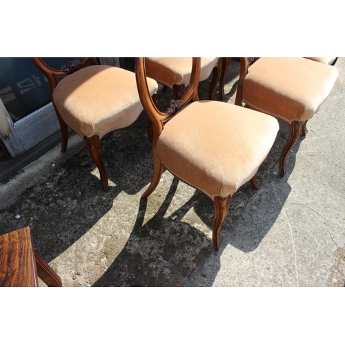 589 - A set of six 19th century carved walnut dining chairs with stuffed over seats, on cabriole supports