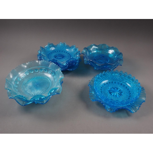 78 - Two pairs of blue glass dishes with shaped rims, 8 3/4