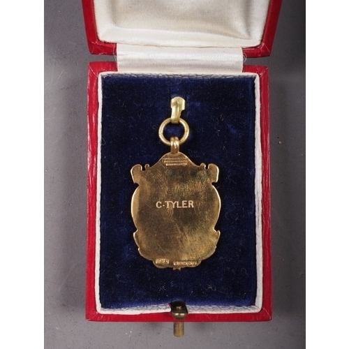 443 - A 9ct gold and enamelled medal, 9.2g, in fitted case