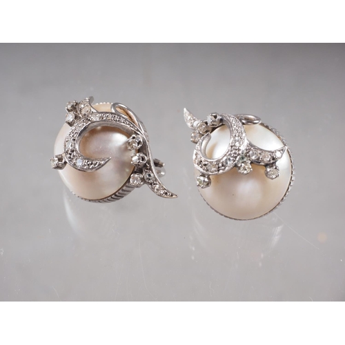 392 - A pair of white metal diamond and half pearl ear clips, total weight 16.4g