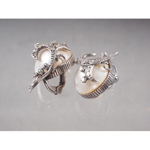 392 - A pair of white metal diamond and half pearl ear clips, total weight 16.4g