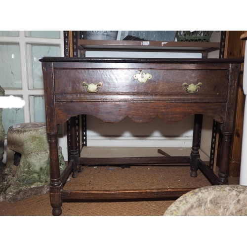 566 - A 19th century provincial oak side table, fitted one drawer, on turned and stretchered supports, 33